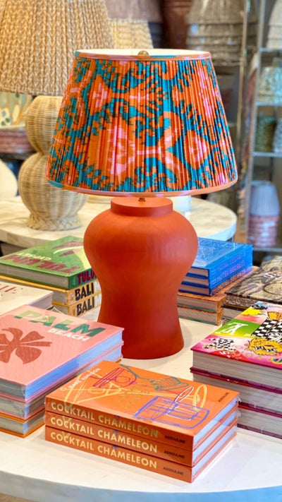 Large orange lamp and ikat lampshade