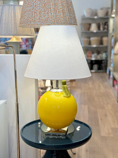 Yellow sphere lamp and green tassel