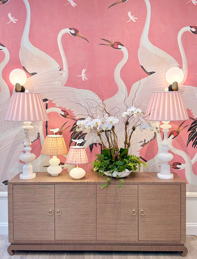 Alabaster Mini Orb Lamp with fermoie lampshade in a Decorative setup with lamps against a pink wall with crane design