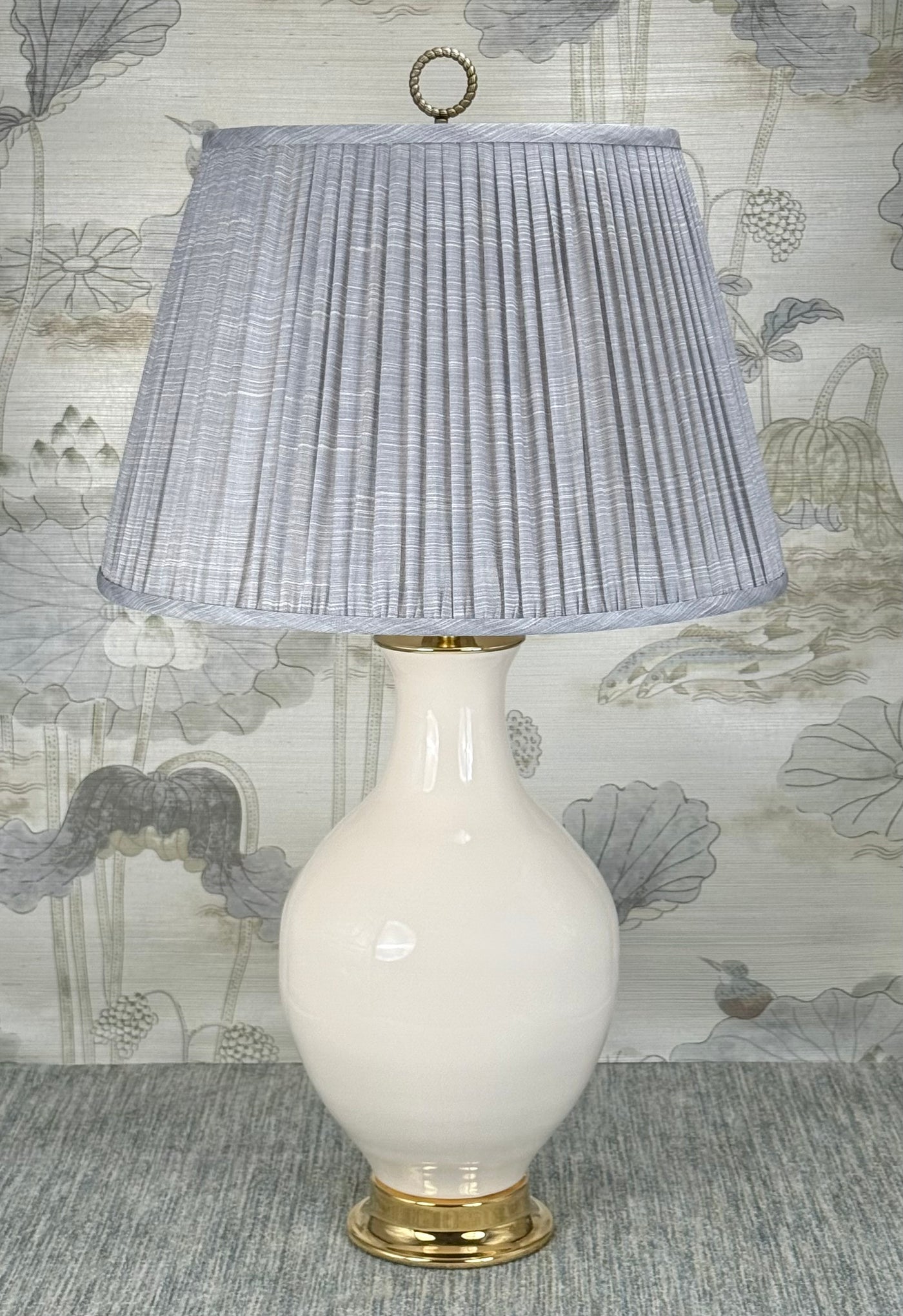 Antique Brass Ring lamp finial styled with a Fermoie strie lampshade on a Paul Schneider Athens ceramic lamp