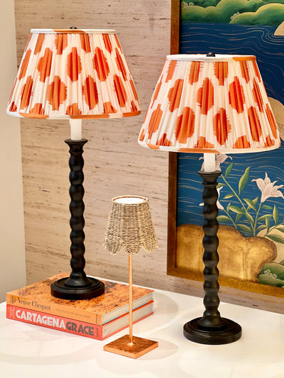 Gathered empire lampshade in Orange & Ivory hand-loomed silk Ikat on black spindle lamps