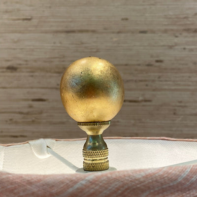 gilded ball finial