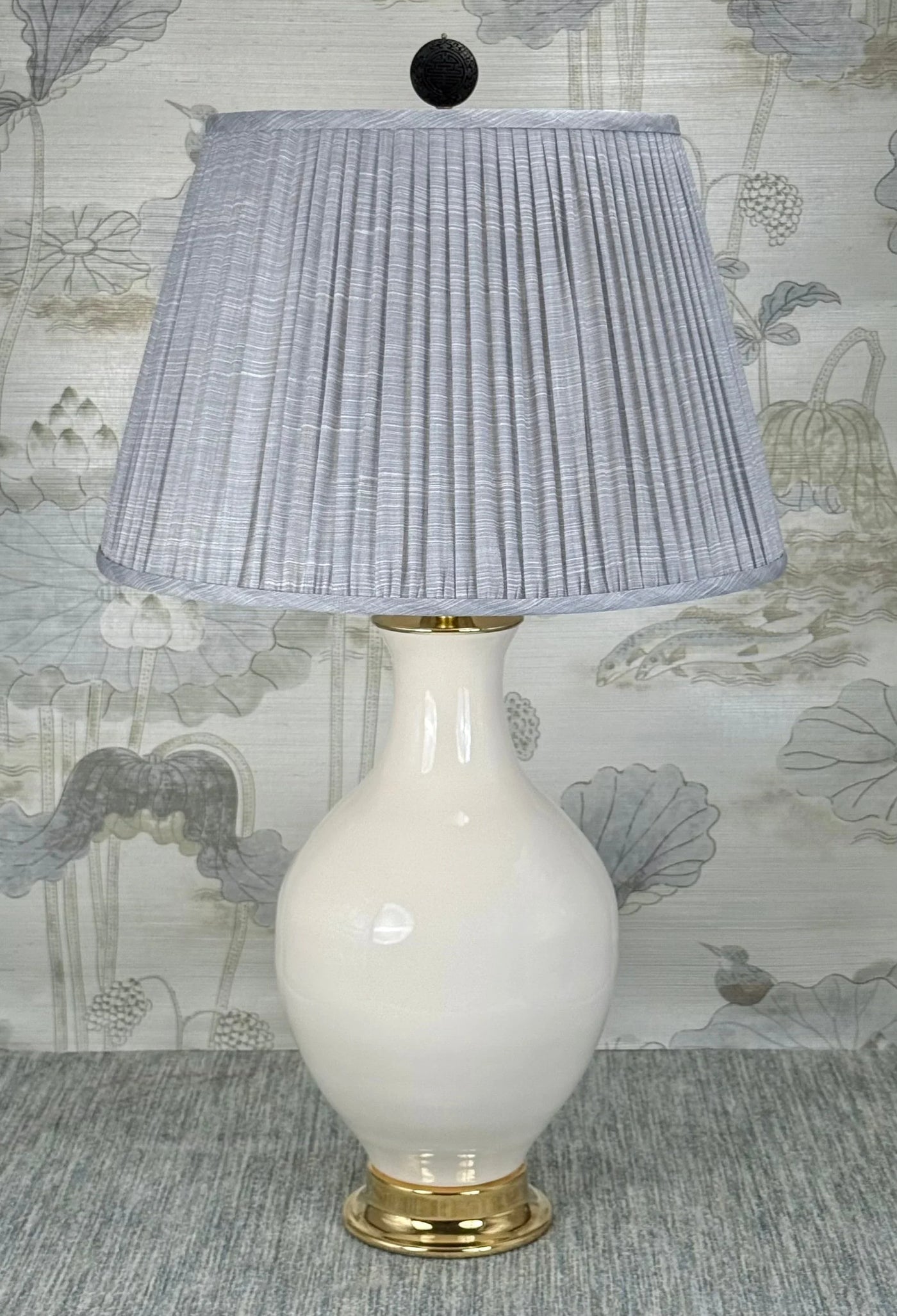Black Cinnabar Disk lamp finial styled with a Fermoie strie lampshade on a Paul Schneider Athens ceramic lamp