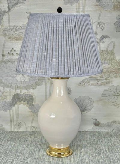 Black Cinnabar Dragon Finial styled with a Fermoie strie lampshade on a Paul Schneider Athens ceramic lamp