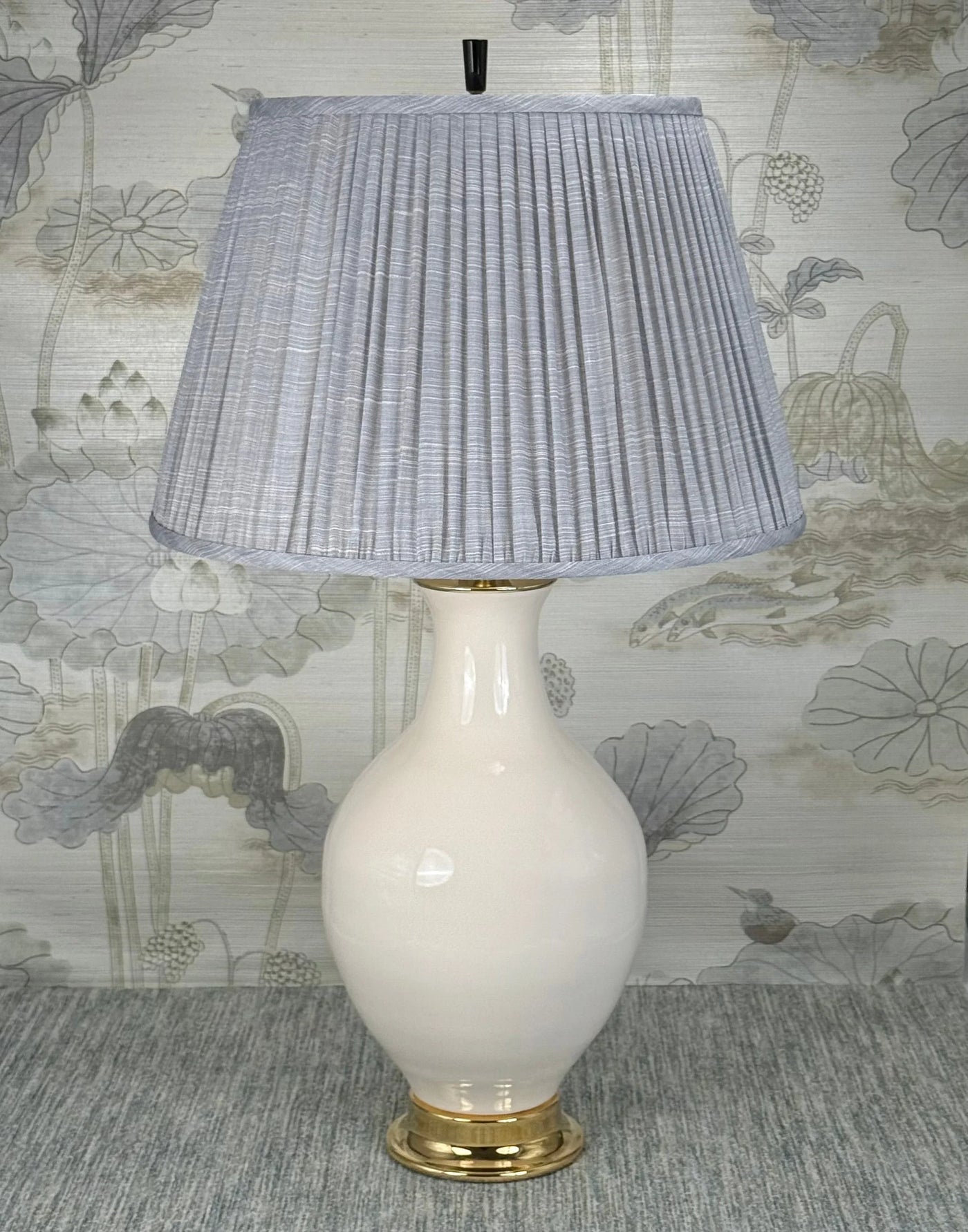 Black Obsidian Cylinder Finial with Polished Brass Base styled with a Fermoie strie lampshade on a Paul Schneider Athens ceramic lamp