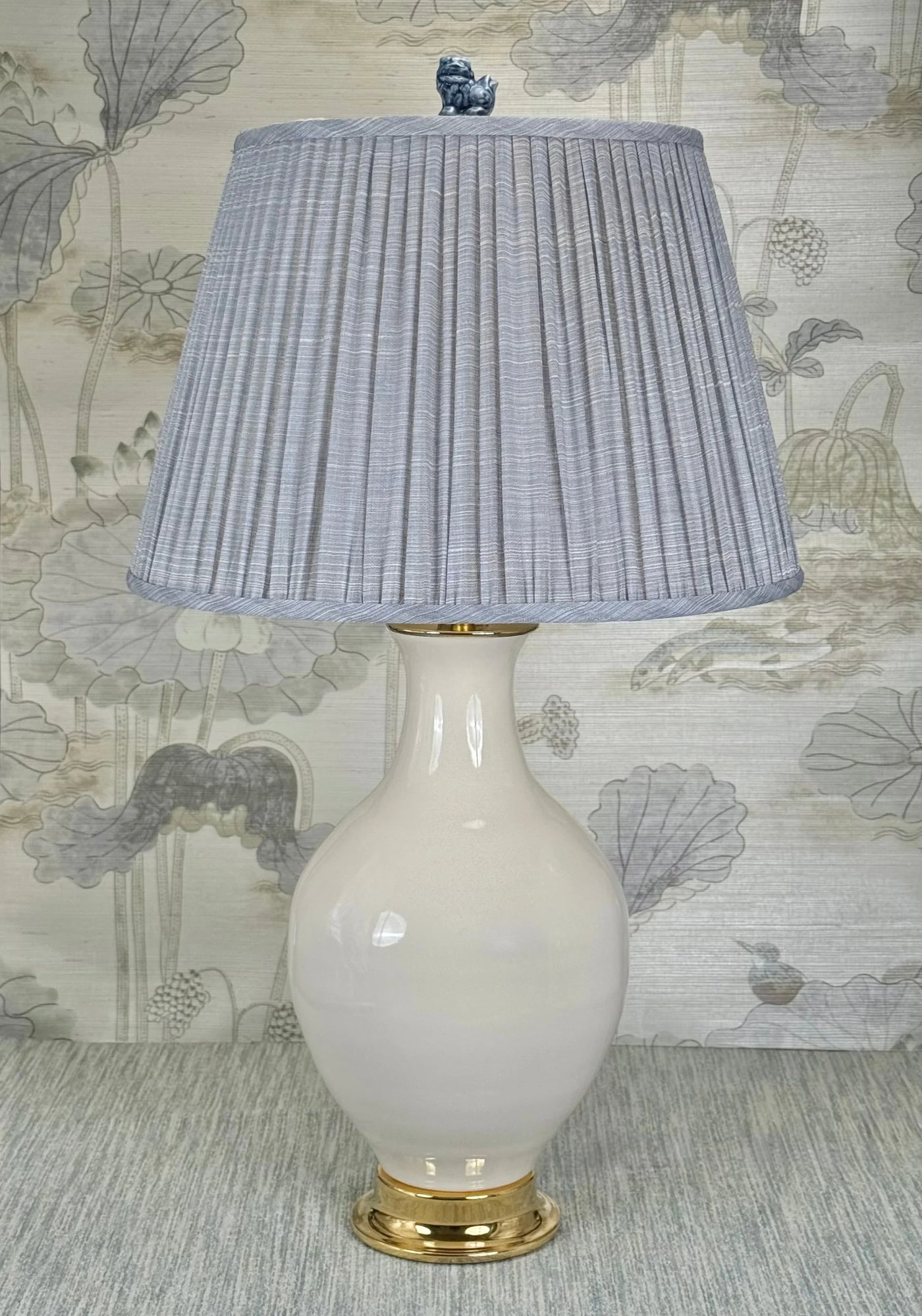 Blue Foo Dog lamp finial styled with a Fermoie strie lampshade on a Paul Schneider Athens ceramic lamp