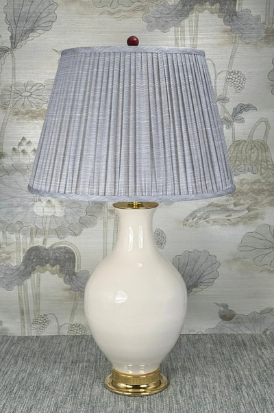 Burgundy Ceramic lamp finial styled with a Fermoie strie lampshade on a Paul Schneider Athens ceramic lamp
