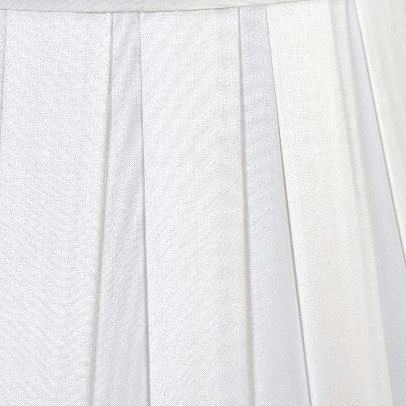Close-up of white pleated fabric