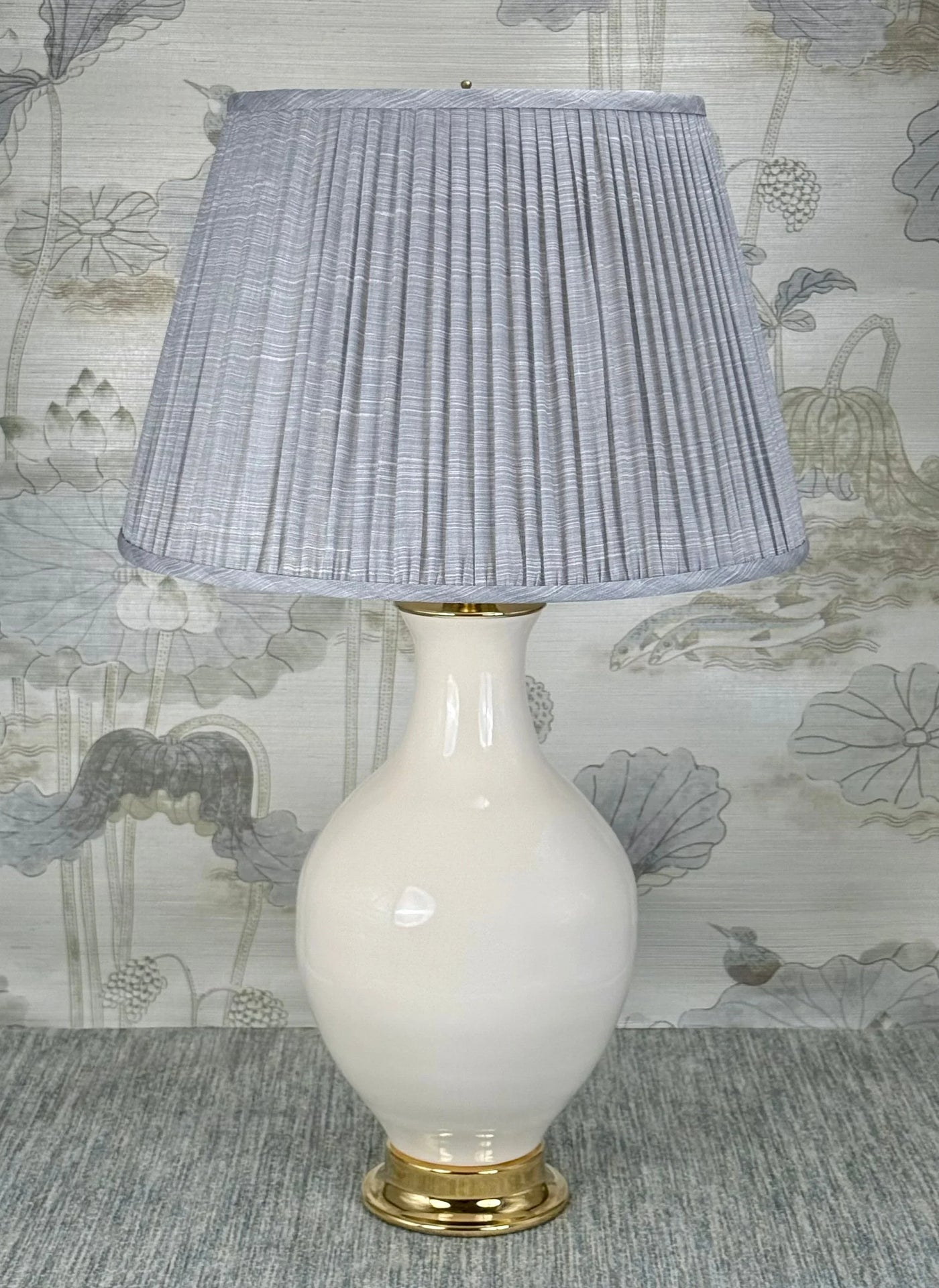 Column Style Amtique Brass lamp finial styled with a Fermoie strie lampshade on a Paul Schneider Athens ceramic lamp.