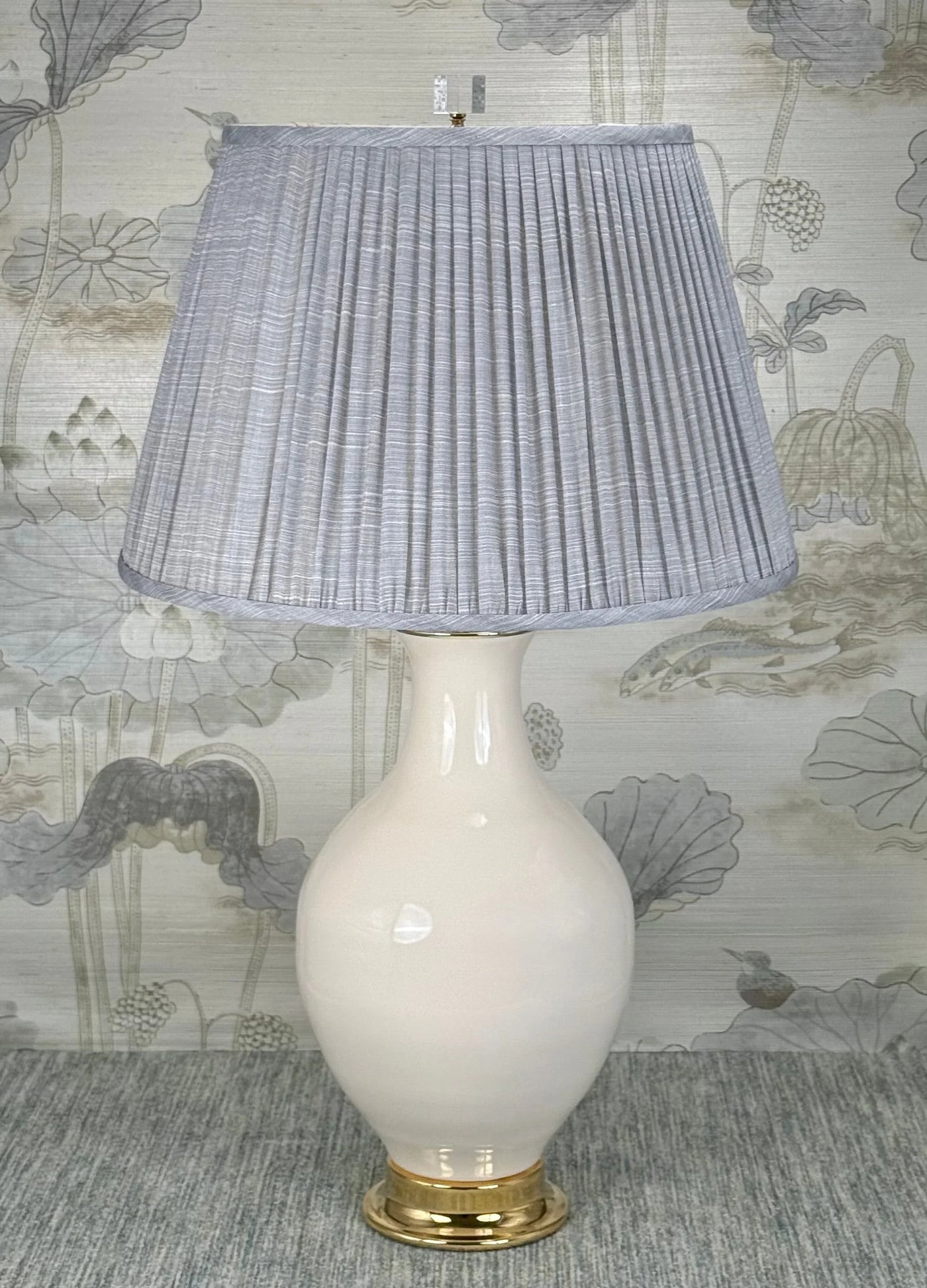 Crystal Cube Finial with Polished Brass Base styled with a Fermoie strie lampshade on a Paul Schneider Athens ceramic lamp