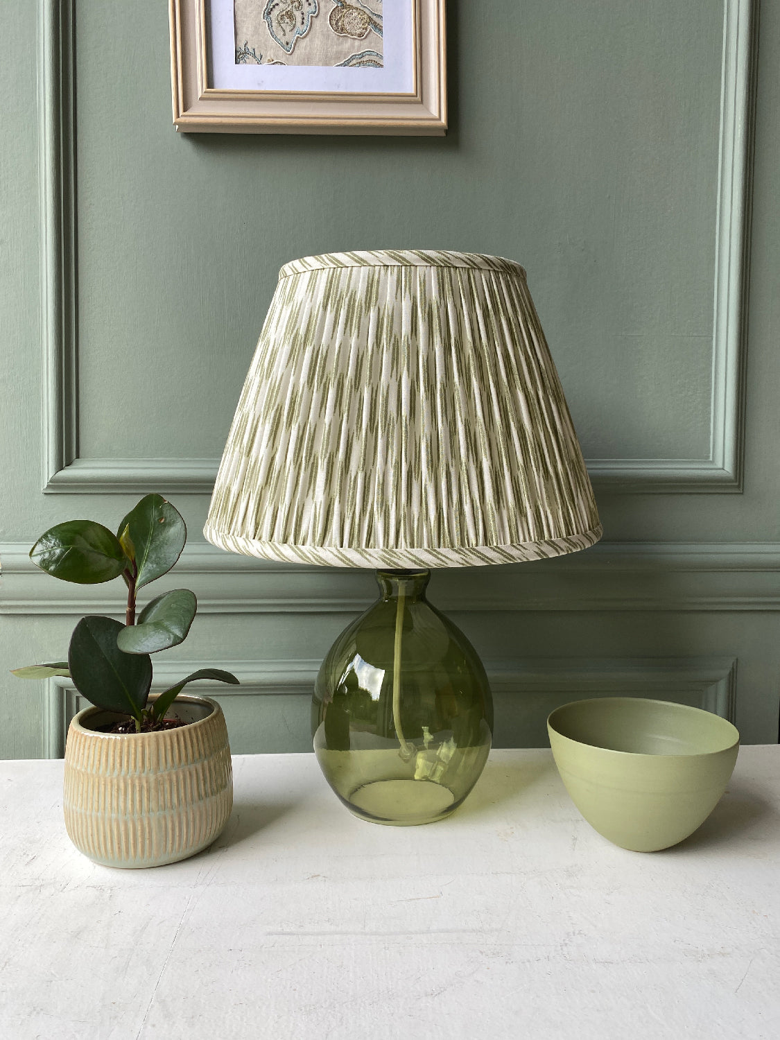 Small green and white lampshade on green lamp