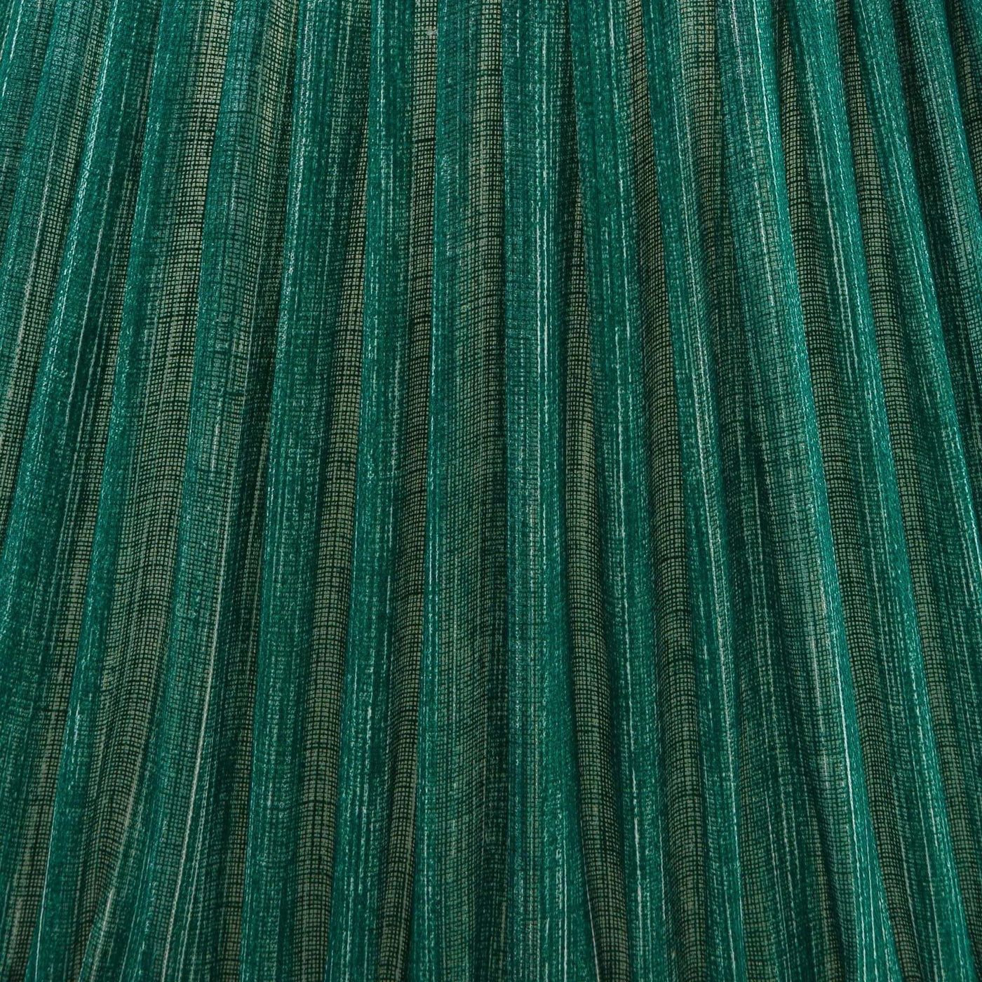 Close-up of green pleated Fermoie fabric showing detailed texture of the lampshade