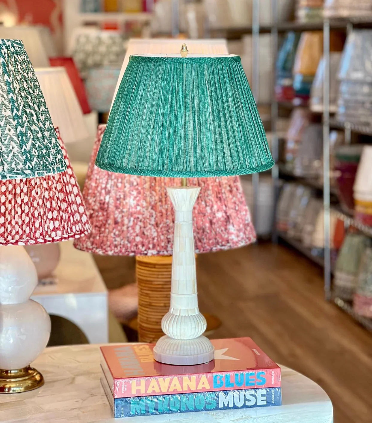 Luxurious green pleated empire lampshade in Fermoie fabric displayed on a Penny Morrison bone lamp