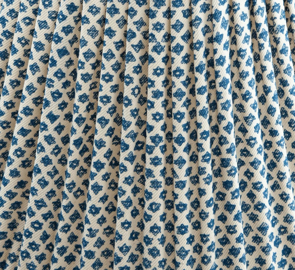 Close-up of luxury designer gathered empire lampshade in Fermoie Blue Marden fabric, showing intricate blue floral pattern and textured fabric details.