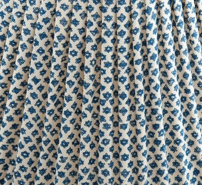 Close-up of luxury designer gathered empire lampshade in Fermoie Blue Marden fabric, showing intricate blue floral pattern and textured fabric details.