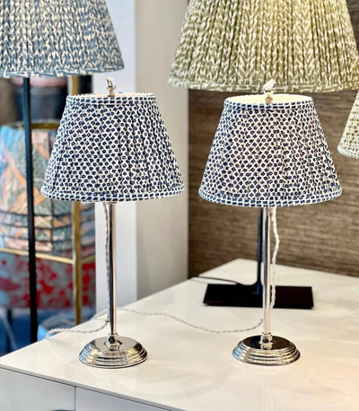 Pair of Fermoie Blue Marden gathered empire lampshades with a blue floral pattern displayed on matching silver table lamps, perfect for adding a touch of luxury to any space.