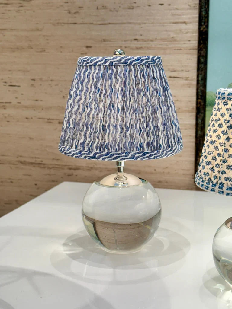 Luxury Fermoie Blue Popple gathered empire lampshade with wavy blue and white pattern displayed on a tiny terri lamp
