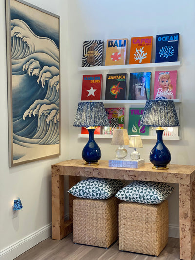 Luxury Fermoie Blue Quartz fabric with a speckled blue and white pattern, featuring designer pleated detailing, displayed on a deep blue lamp