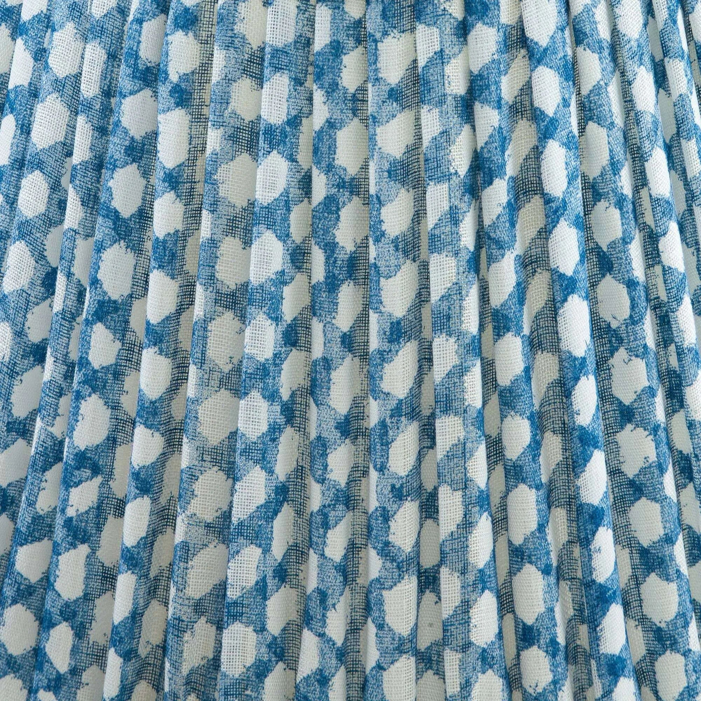 Close up of luxury designer Fermoie Blue Wicker gathered empire lampshade with blue and white woven pattern