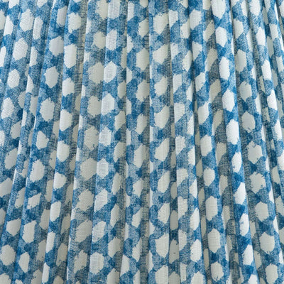 Close up of luxury designer Fermoie Blue Wicker gathered empire lampshade with blue and white woven pattern