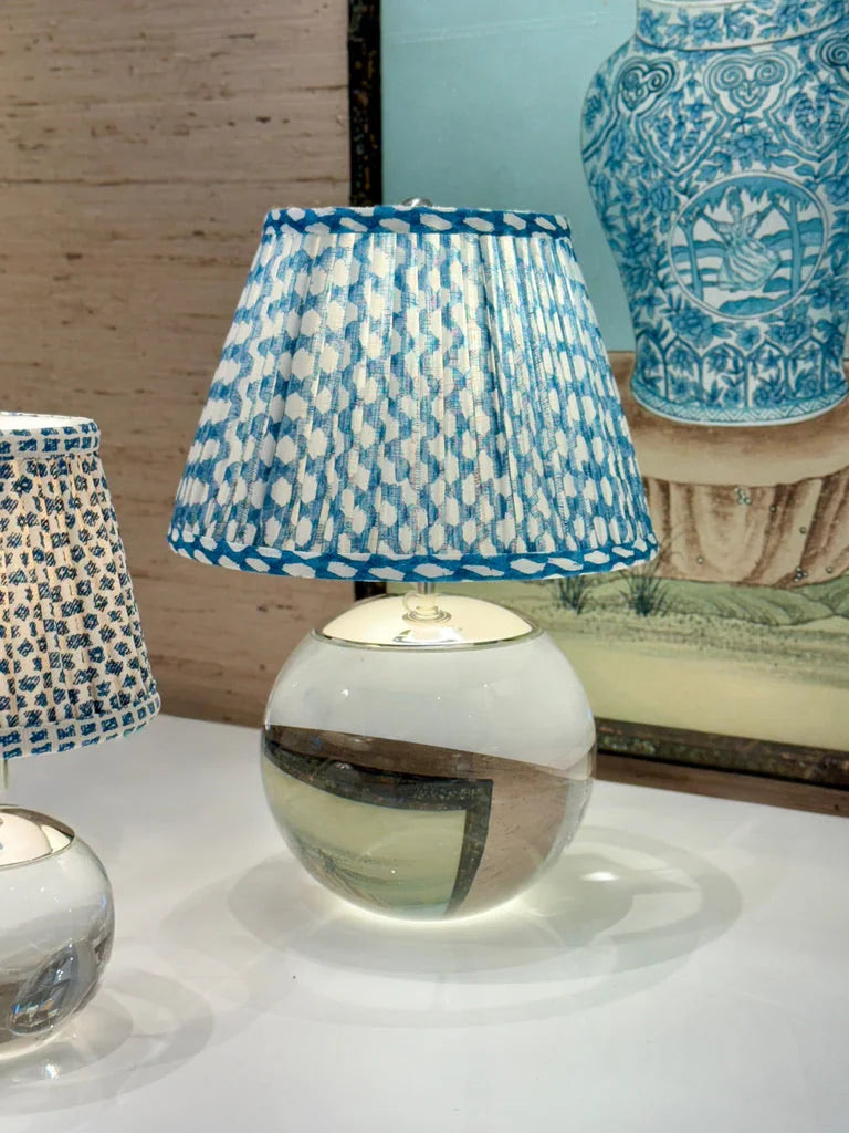 Luxury designer Fermoie Blue Wicker gathered empire lampshade with blue and white woven pattern displayed on a crystal lamp