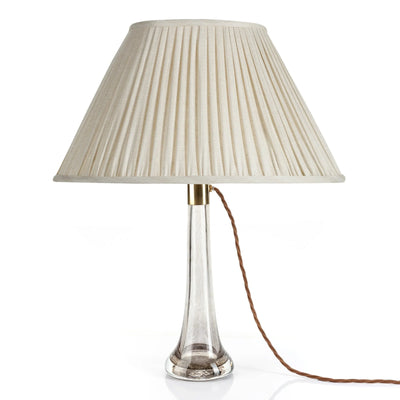 Front view of luxury designer Fermoie Cream Moire empire oval lampshade with pleated cream linen fabric for a timeless look