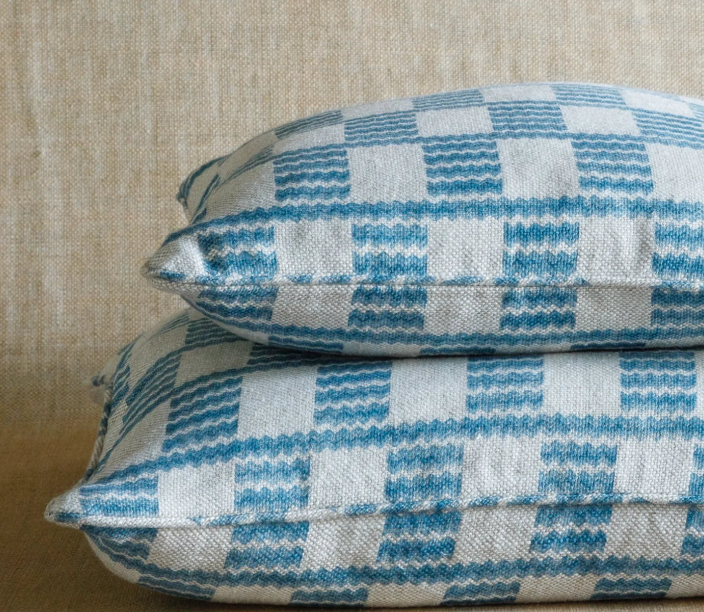 Designer Fermoie cushion stack in Light Blue Cove fabric linen