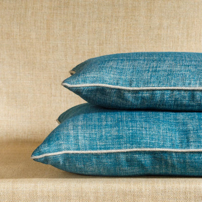 Designer Fermoie cushion stack in Suede Shoes blue linen fabric