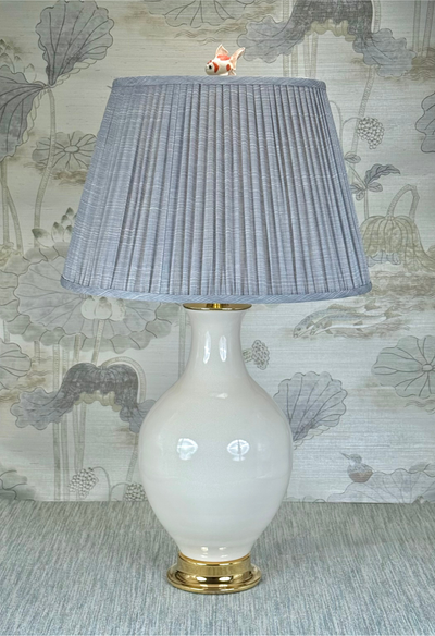 Goldfish lamp finial styled with a Fermoie strie lampshade on a Paul Schneider Athens ceramic lamp.
