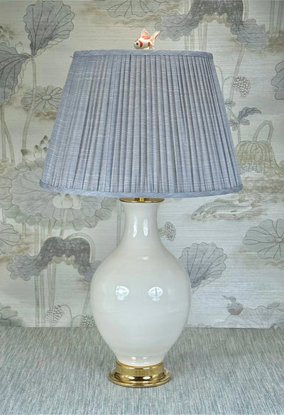 Goldfish lamp finial styled with a Fermoie strie lampshade on a Paul Schneider Athens ceramic lamp.