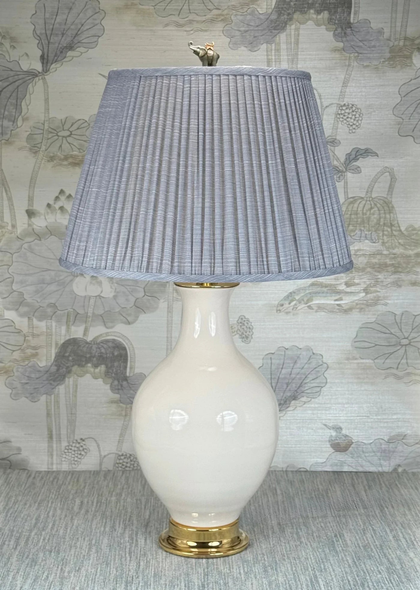 Elephant lamp finial styled with a Fermoie strie lampshade on a Paul Schneider Athens ceramic lamp.