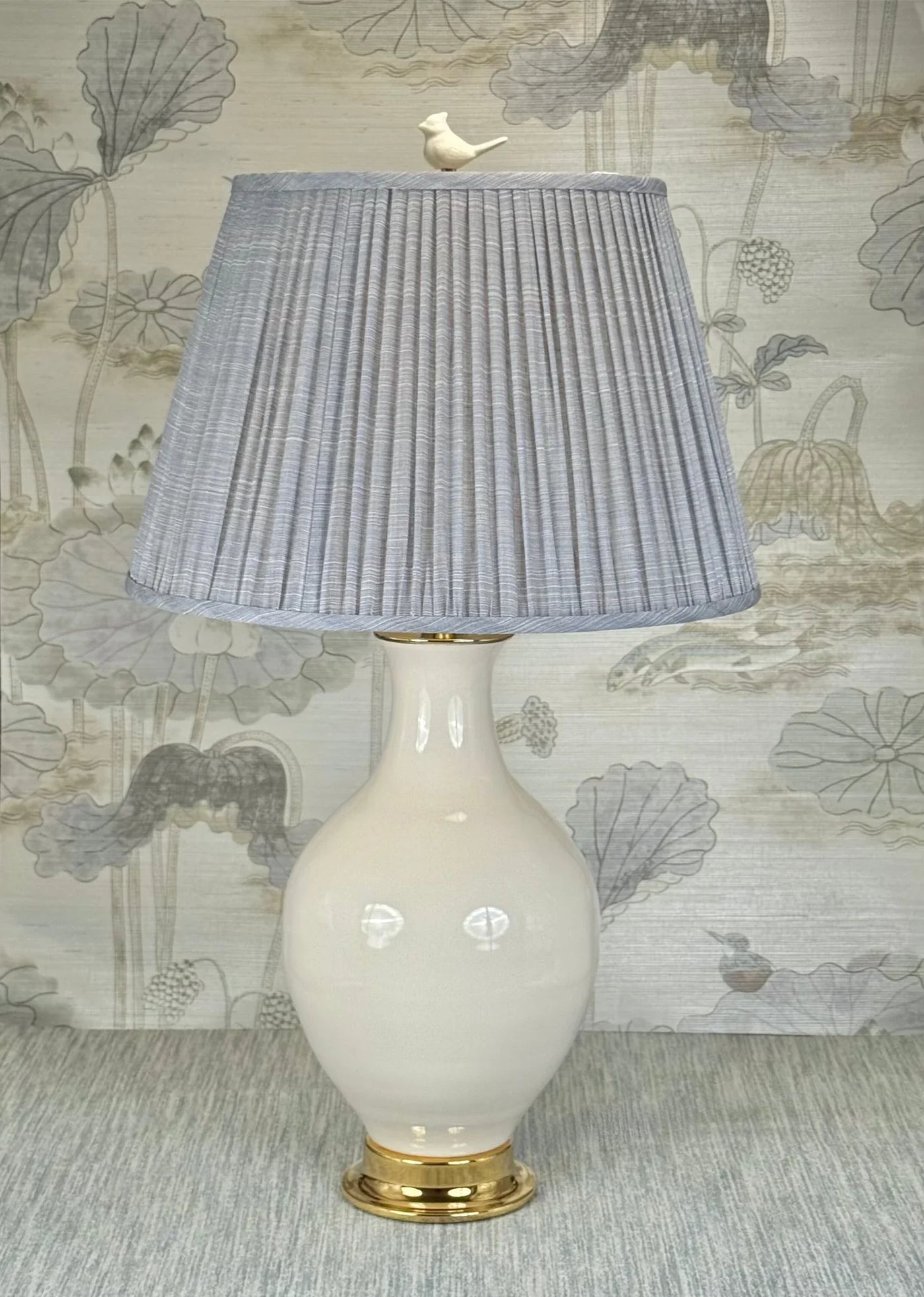 white bird lamp finial styled with a Fermoie strie lampshade on a Paul Schneider Athens ceramic lamp.