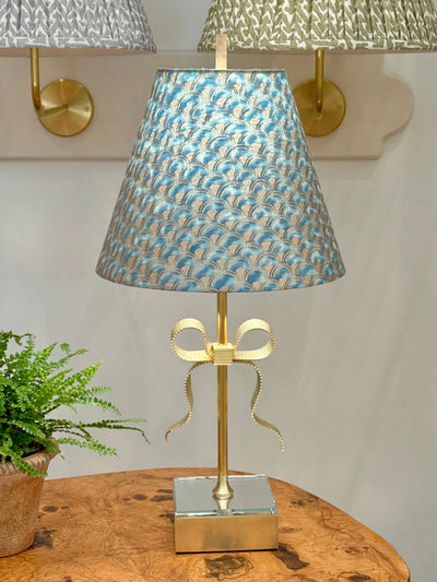 Fortuny - Papiro in Blue Green & Silvery Gold Fabric Lampshade on gold bow lamp