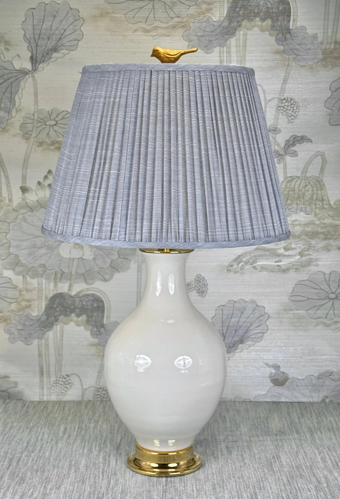 Gold Bird lamp finial styled with a Fermoie strie lampshade on a Paul Schneider Athens ceramic lamp.