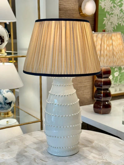 Gold Sari Lampshade with Navy Silk Trim on white spitzy table lamp