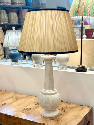 Gold Sari Lampshade with Navy Silk Trim on bone lamp