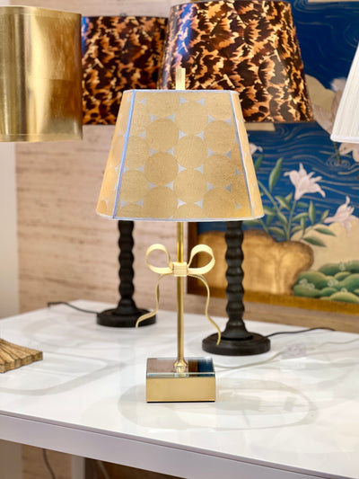 Gracie wallpaper lampshade on a gold ribbon lamp
