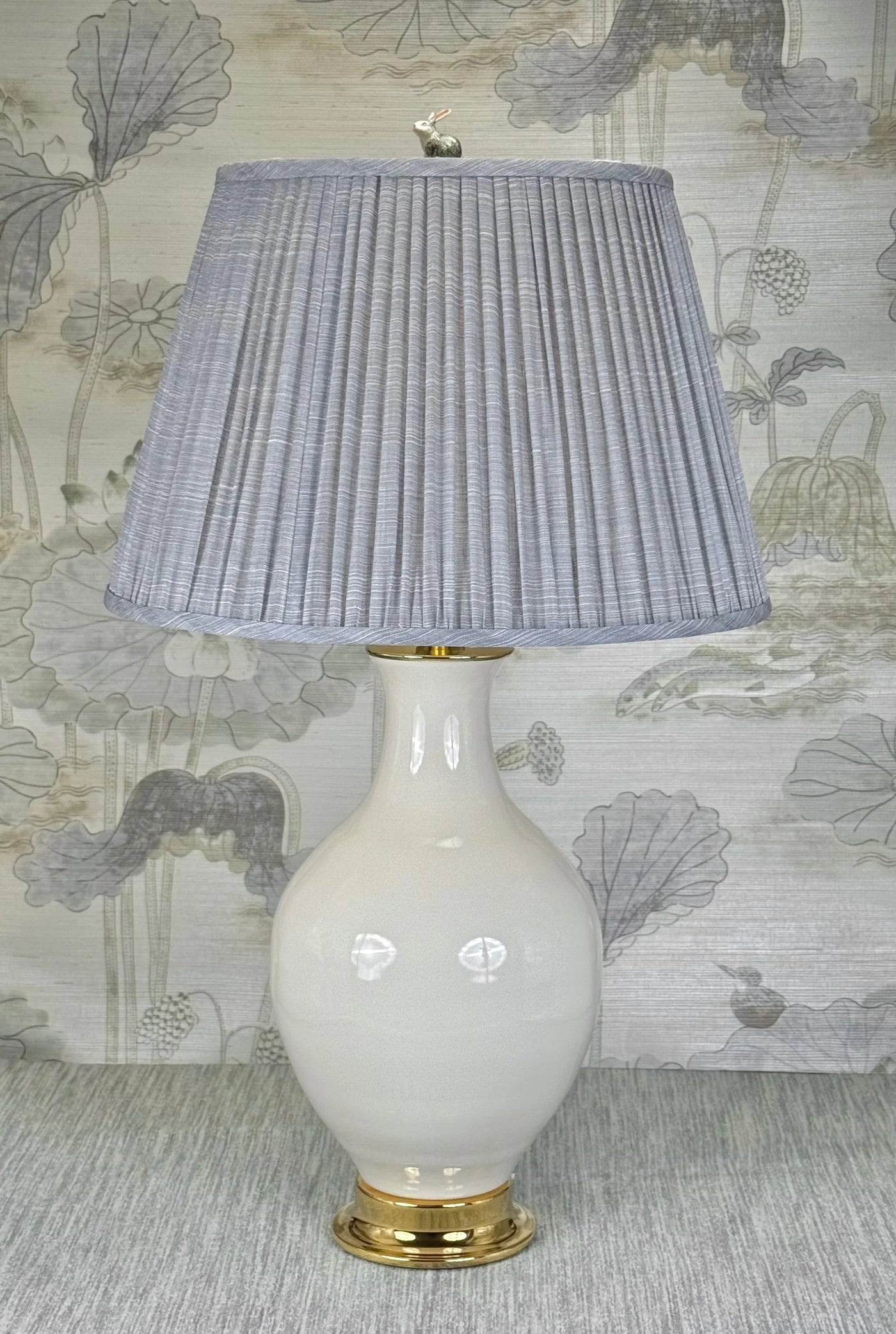Gray Rabbit  lamp finial styled with a Fermoie strie lampshade on a Paul Schneider Athens ceramic lamp.