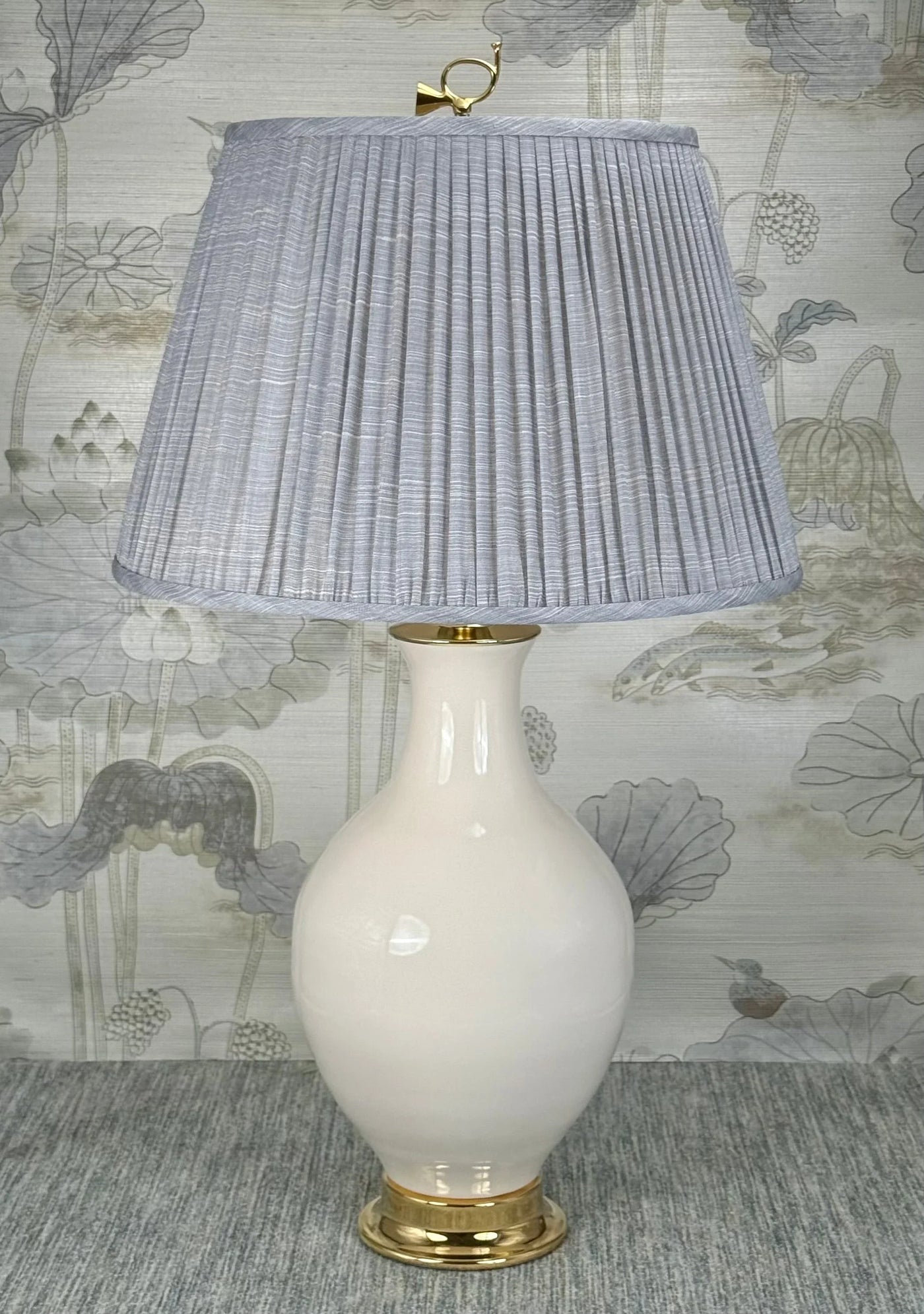 Hunter's Horn Brass    lamp finial styled with a Fermoie strie lampshade on a Paul Schneider Athens ceramic lamp