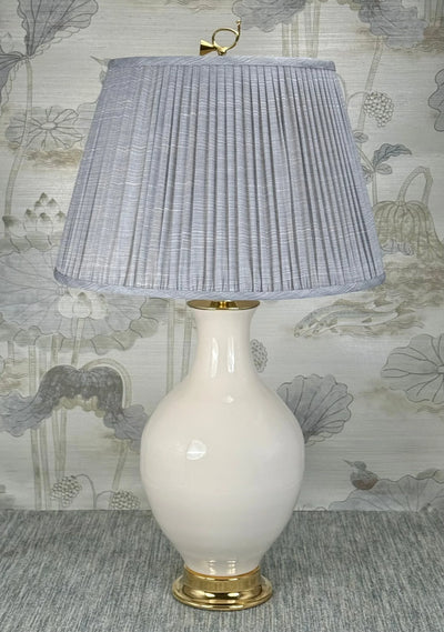 Hunter's Horn Brass    lamp finial styled with a Fermoie strie lampshade on a Paul Schneider Athens ceramic lamp