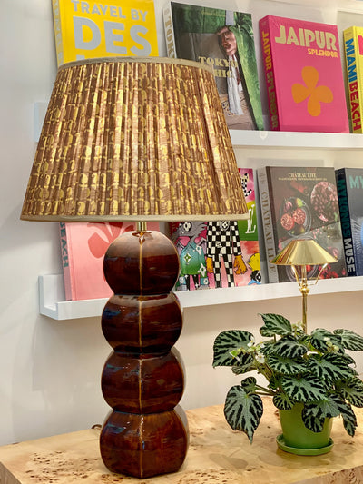 Hwang Bishop Barnacle Table lamp in tortoise with a Penny Morrison gold and olive motif with gold trim lampshade.