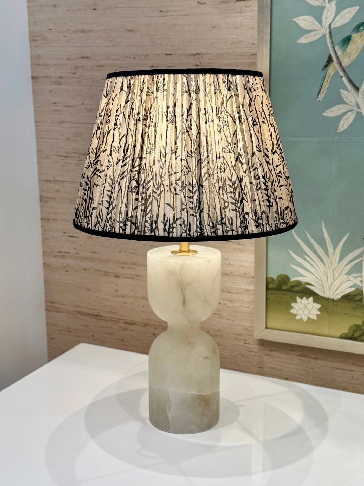Taupe silk lamp shade with black trim on alabaster lamp 