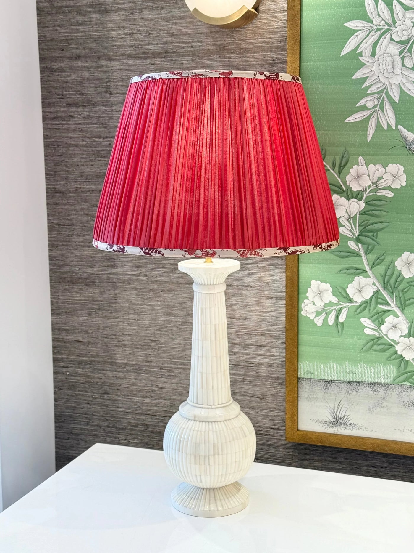Pleated pink silk lamp shade with printed kissing fish trim on lamp