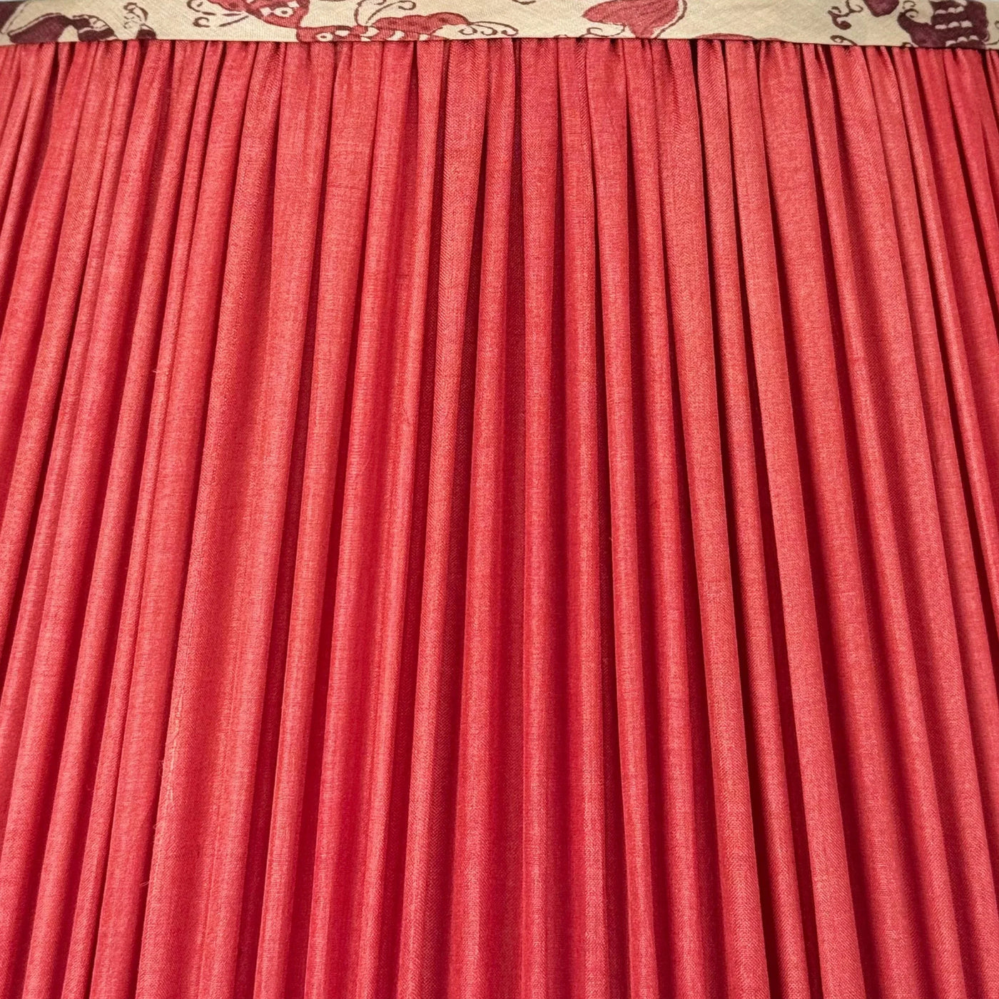 Pleated pink silk lamp shade with printed kissing fish trim