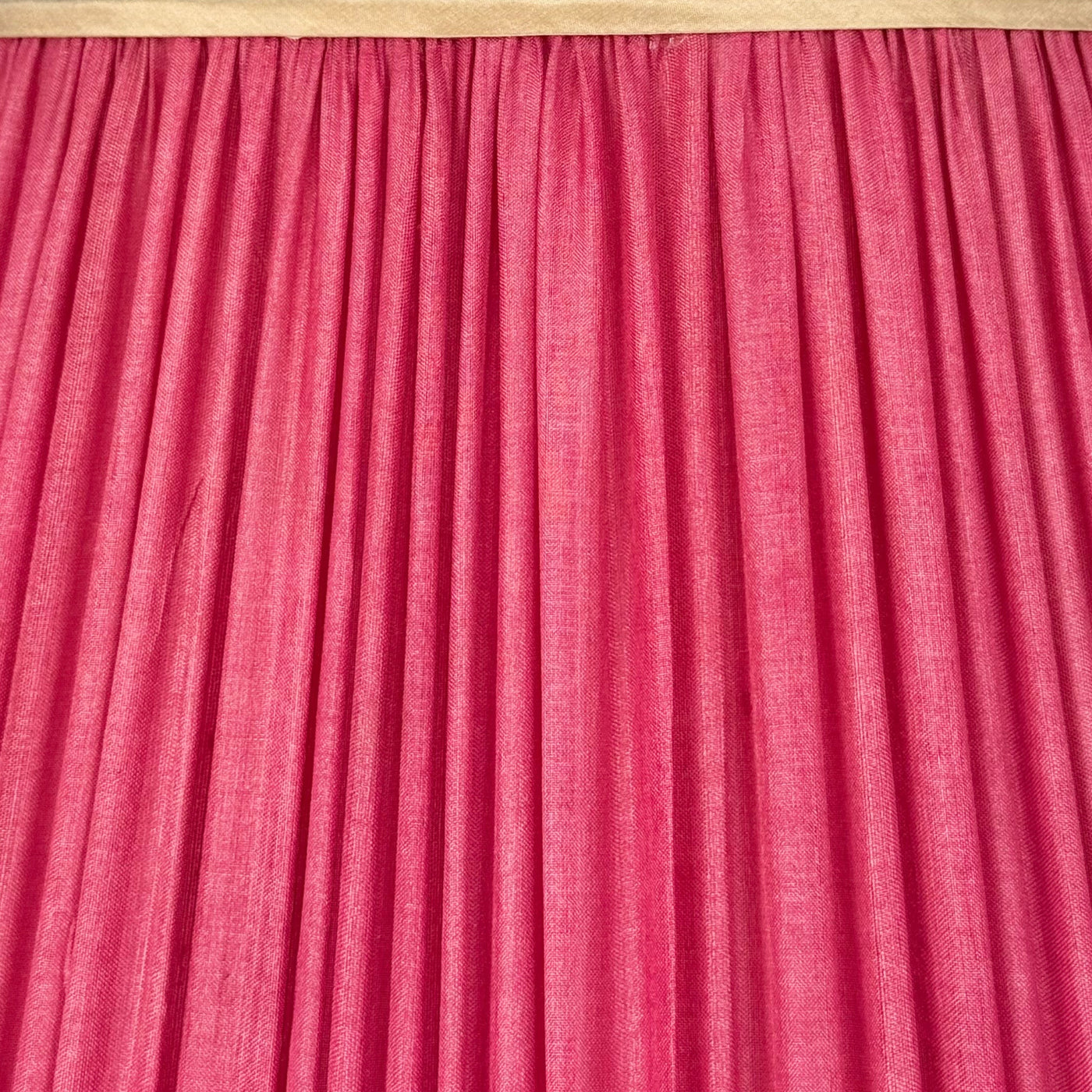 Pleated pink silk lamp shade with champagne-colored trim