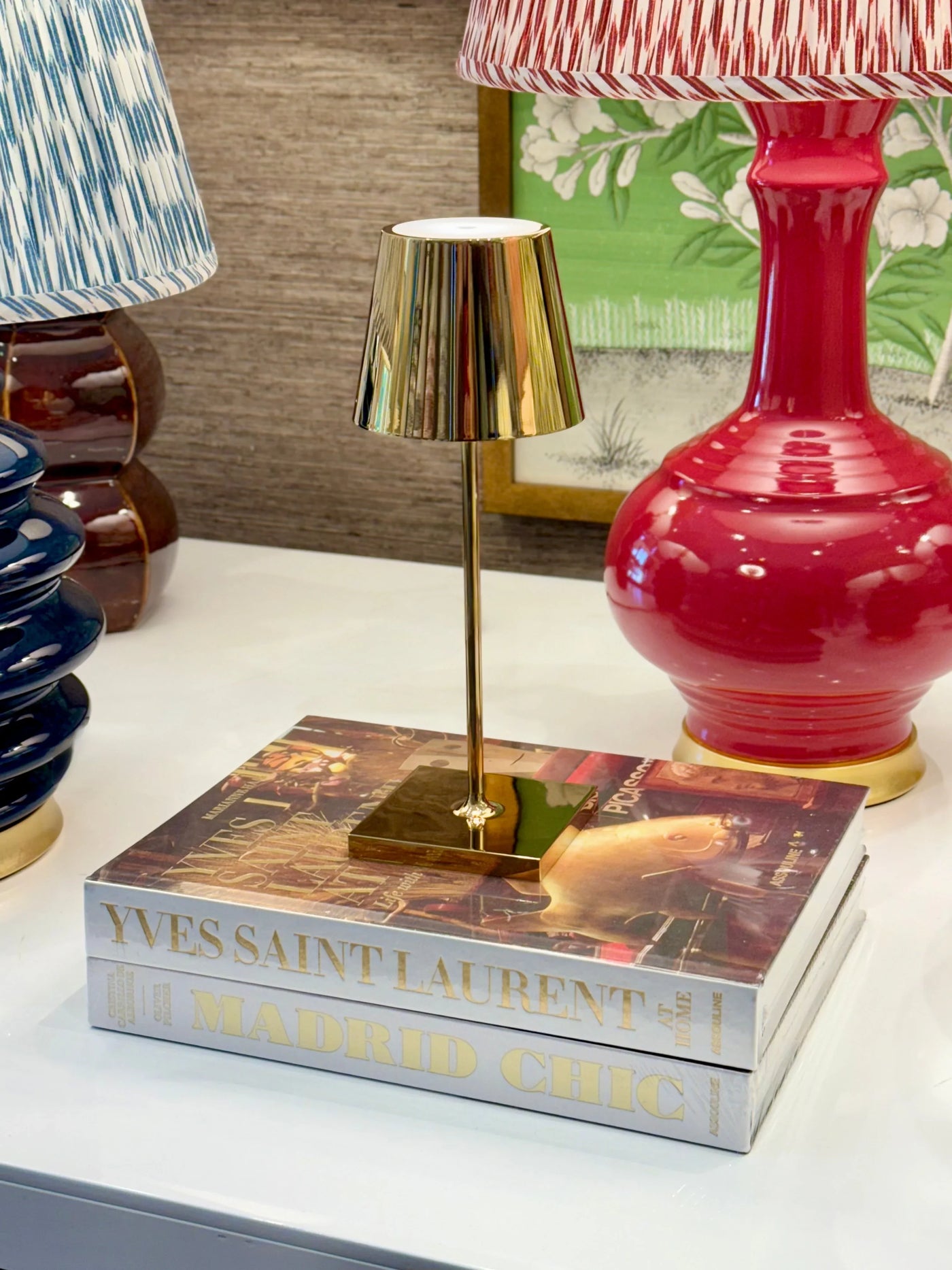 Poldina Pro Mini Table Lamp - Glossy Gold on books