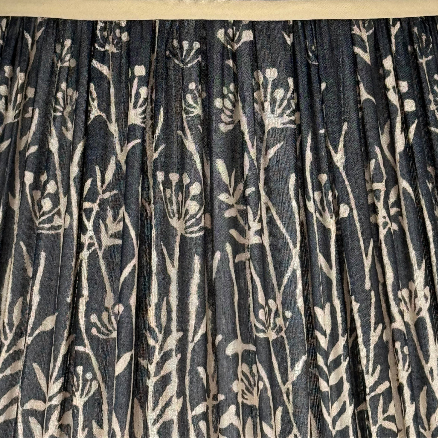 Pleated black and taupe silk lamp shade with champagne trim
