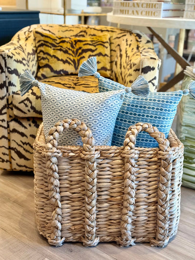 Pair of Ian Sanderson Reel Stripe in Blue Beck and Nettie in Blue Cornflower Cushion with Blue Tassels in woven basket