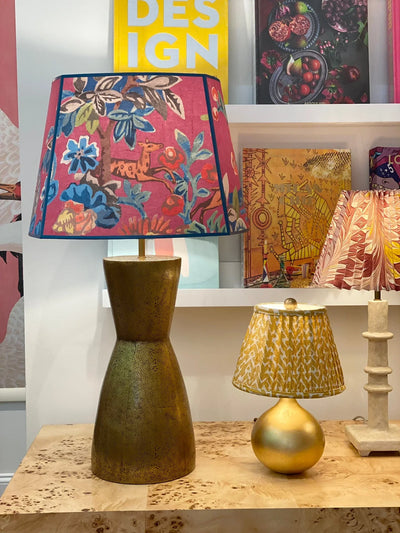 Kit Kemp pink lampshade on a brass lamp
