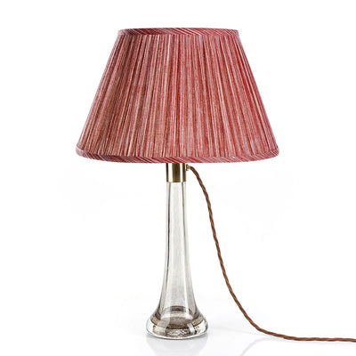 Fermoie red strie lampshade on a glass lamp